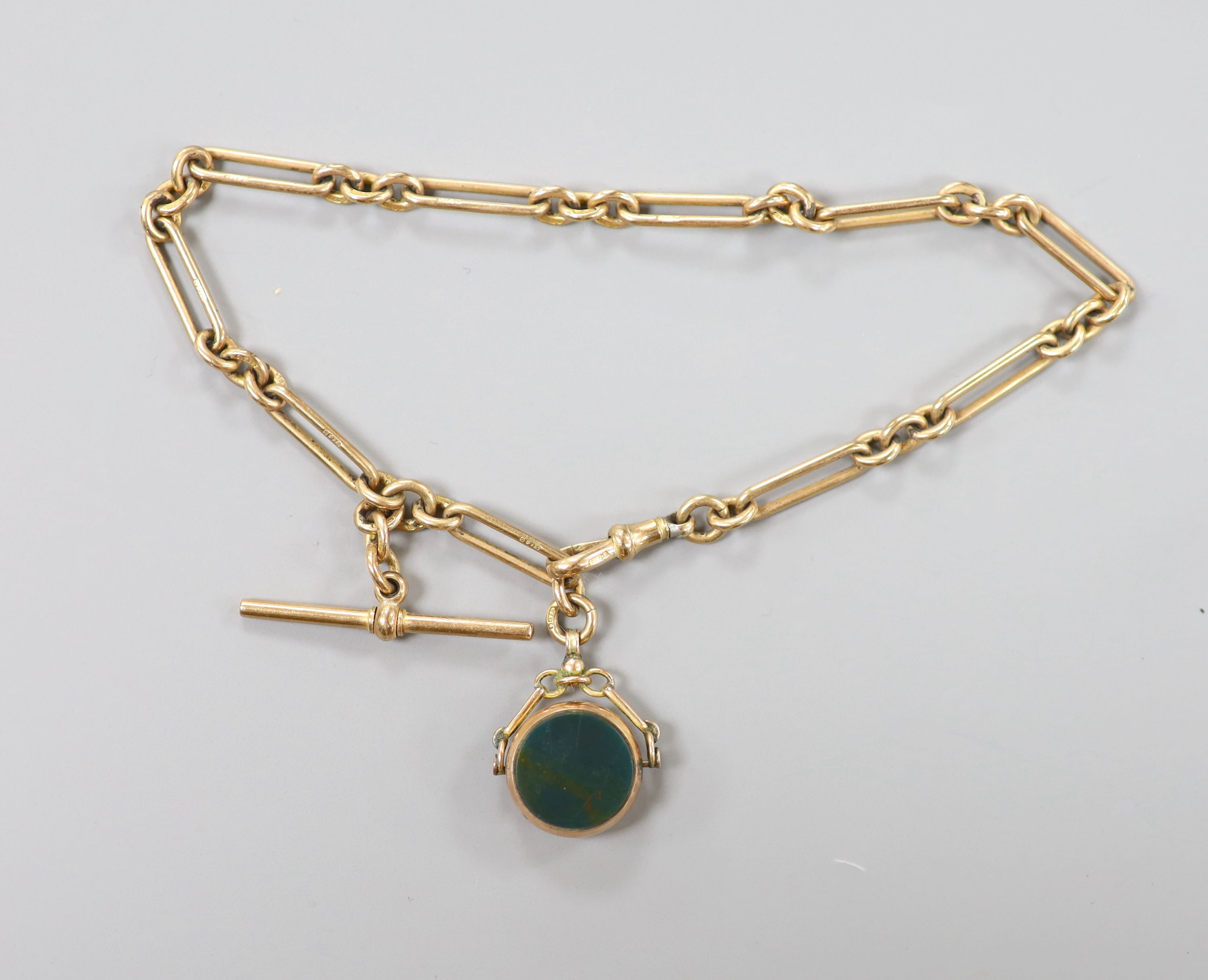 A 9ct gold watch albert, 30cm hung with a 9c, carnelian and bloodstone set spinning fob, gross weight 27.9 grams.